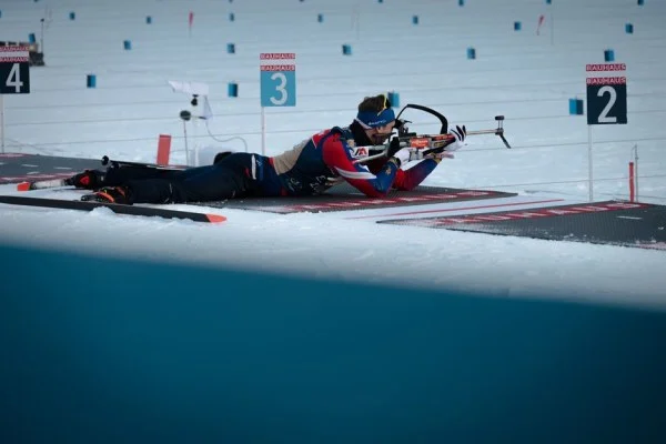 shooting athlete aiming rifle